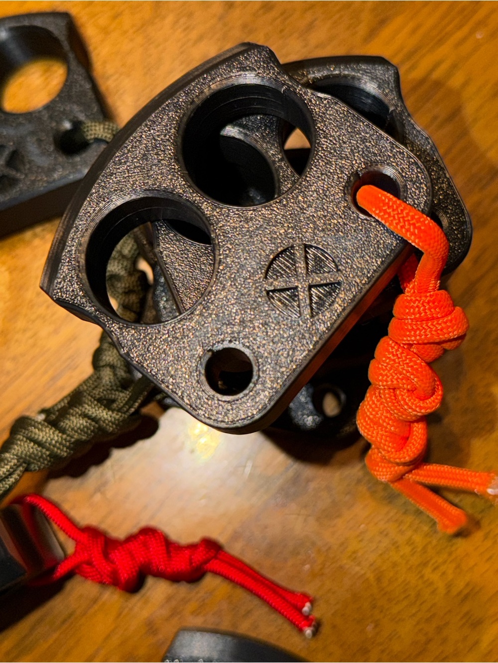 (1) Double Finger Knuckle with orange halloween themed paracord.